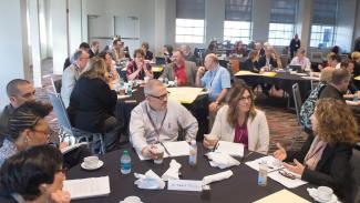 SEC ALDP participants gather at tables.